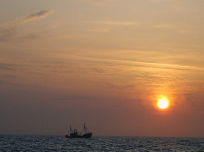 Schip bij zonsondergang