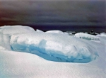 snow-covered icebergs at the shore