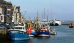 Fishing boats and Channel Islands Ferry in Weymouth Harbour