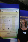 Karin Troost in front of poster