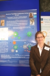 Lucy Woodall in front of poster