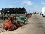 After a long day at sea the nets are soaking up the sun and resting before the next days catch.
  
Whitstable exhibition, England.