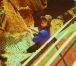 Visser met net aan boord