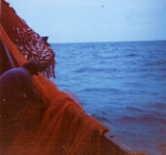 Visser met net aan boord