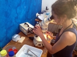 Marine biologist Katja Guilini working at a binocular in a lab on Panarea, studying ocean acidification
